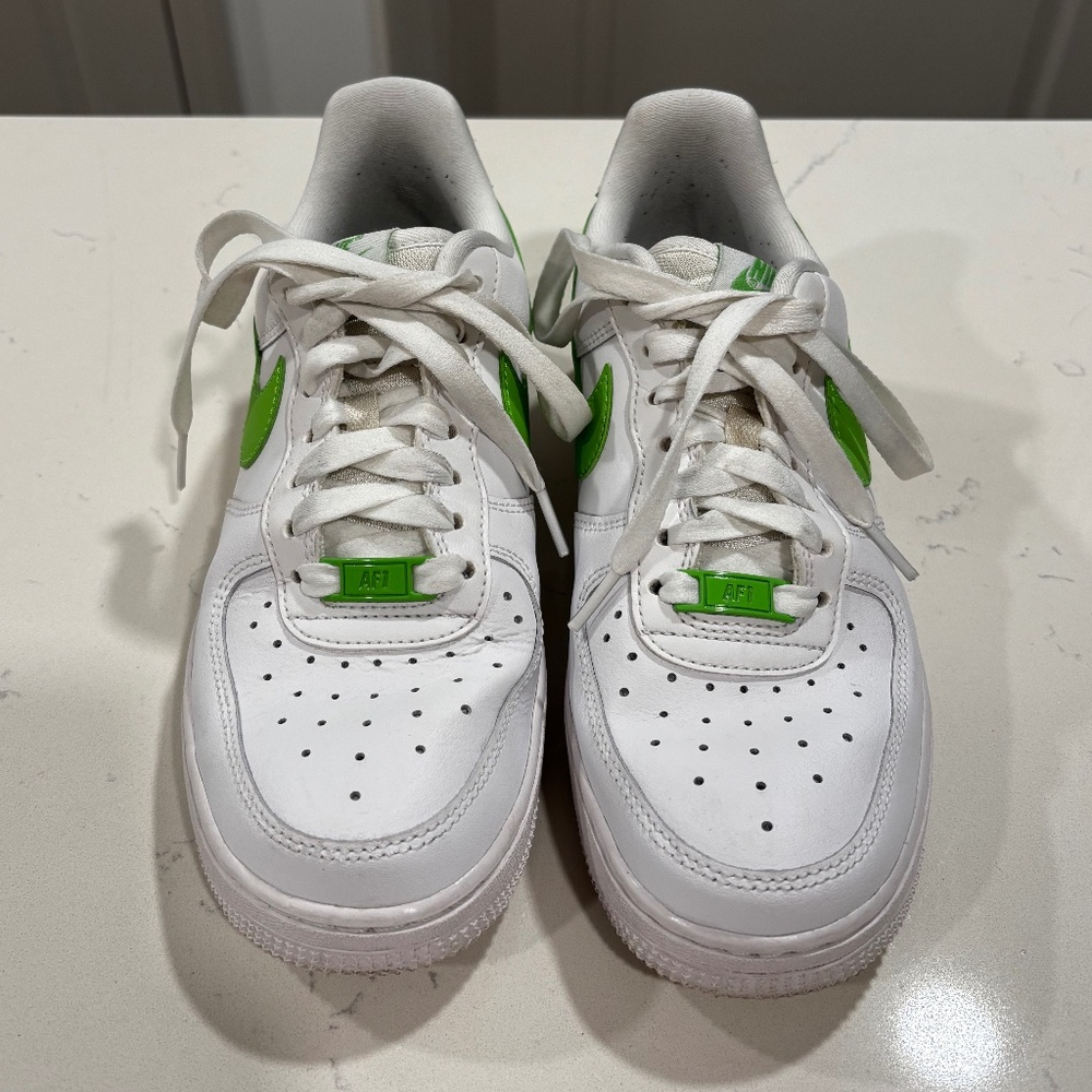 White and lime green Nike Air Force 1s